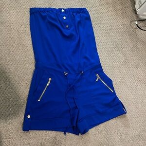 Jumpsuit brand is Cache